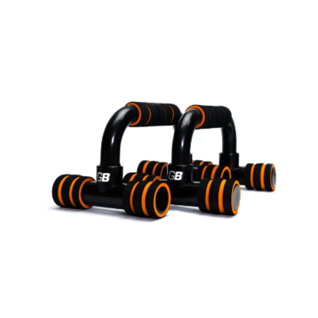 Push-Up Bars, to kompakte svarte treningshåndtak med oransje detaljer og polstrede grep, plassert parallelt.