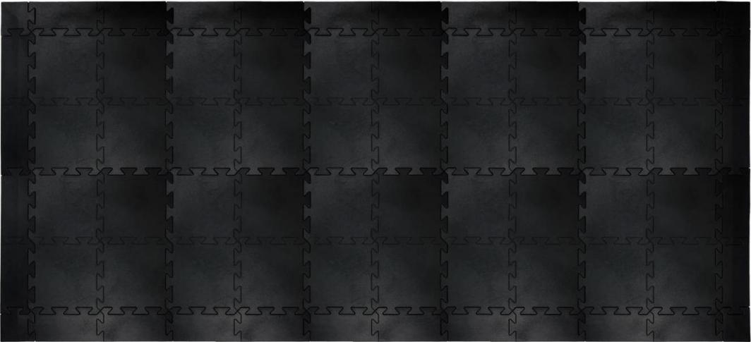 Gummigulv med sorte, sammenkoblede pusselbrikker i mykt materiale, sett ovenfra med matt overflate.