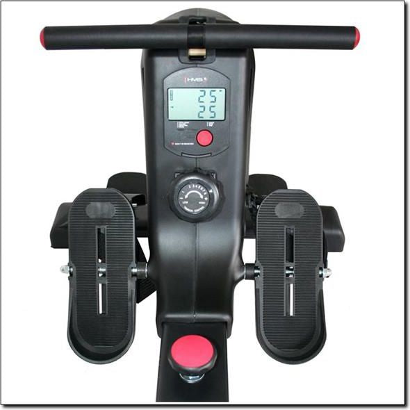 Romaskin Sammenleggbar sett ovenfra med to antiskli fotplater, rødt styre, LCD-skjerm og motstandsknapp.