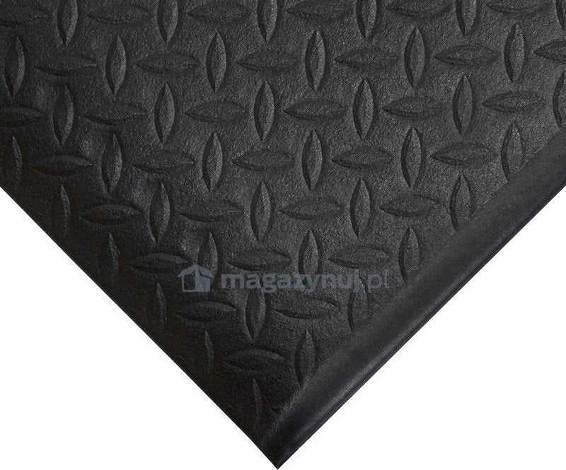 Gummimatte På Rull svart arbeidsmatte med diamantmønster, rullet ut på gulv, viser tekstur og tykkelse.