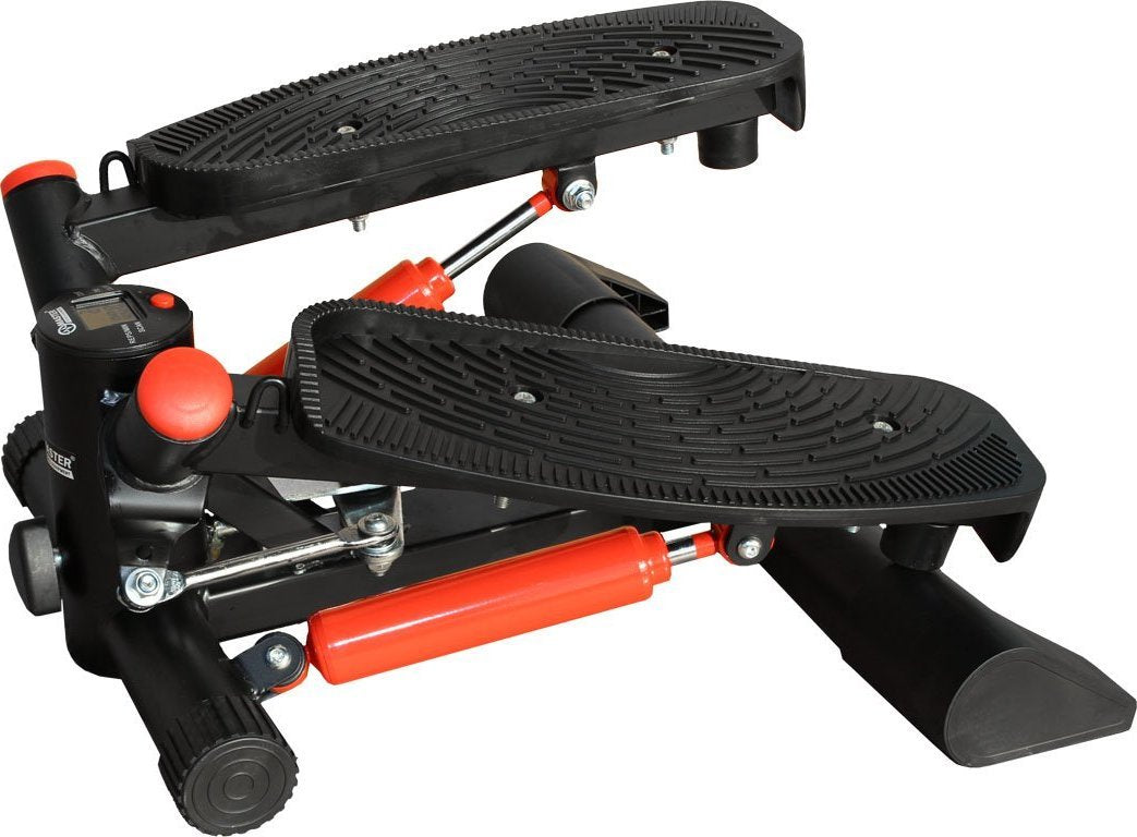 Mini Stepper i sort og rød med store rillede fotplater, synlig treningscomputer og hydrauliske detaljer fra siden.