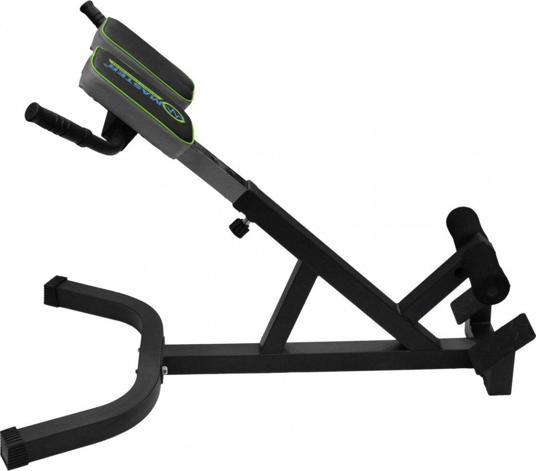 Ryggtrener i sort metall med grå polstring, grønne detaljer, håndtak og benstøtte, sett fra siden.