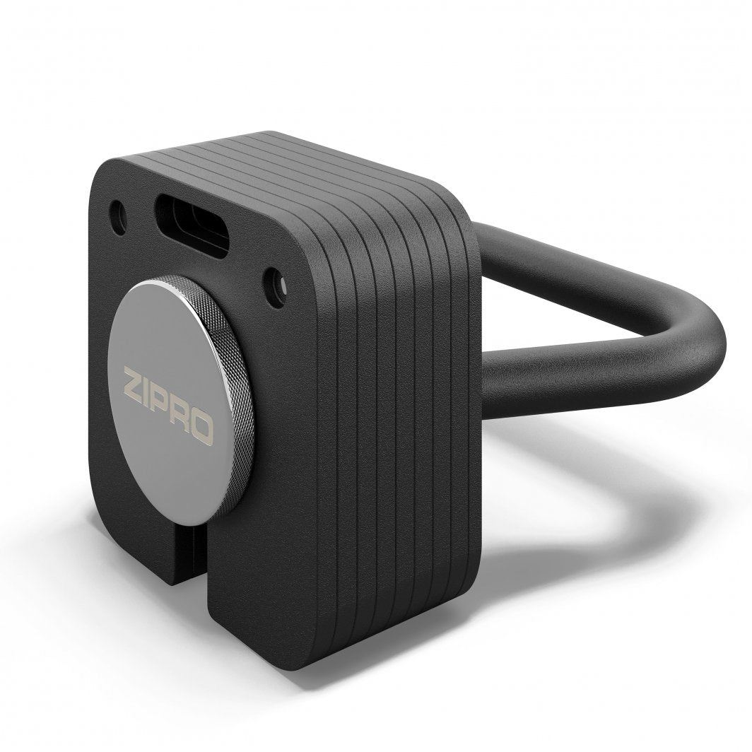 Kettlebell med sort, kvadratisk stålform, sølvfarget dreieknapp med ZIPRO-logo og markerte linjer.