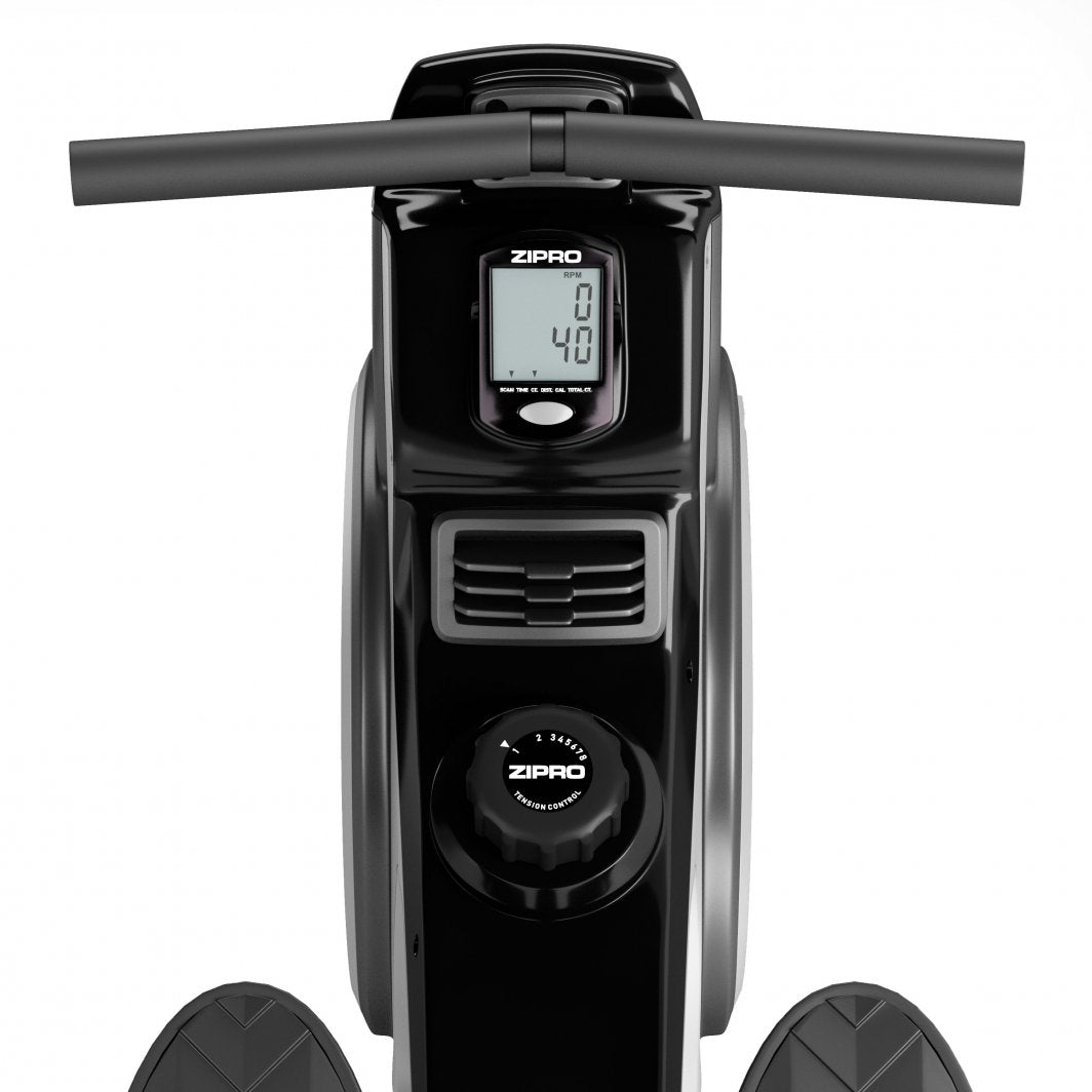 Romaskin i svart med digitalt display, justeringshjul og pedaler, sett ovenfra med fokus på skjerm og kontrollpanel.