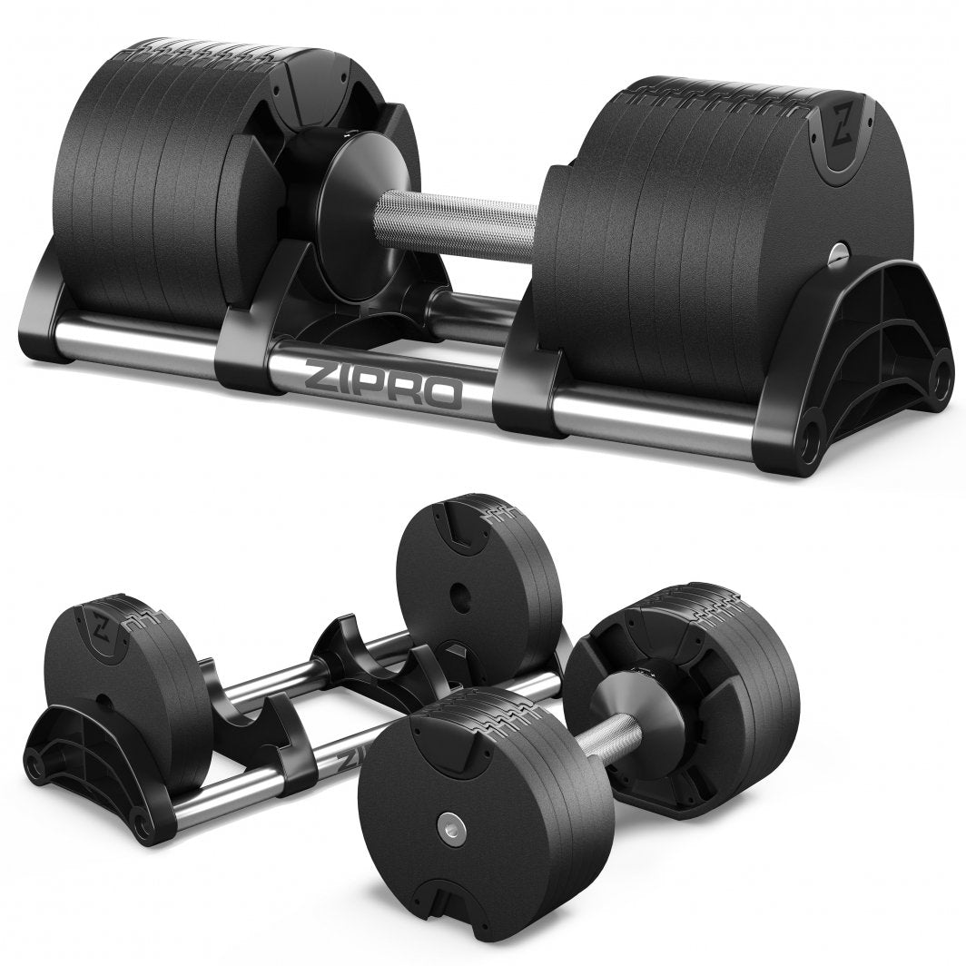 Justerbar Manual, to svarte manualer med metallhåndtak på stativ, synlige vektplater og Zipro-logo.