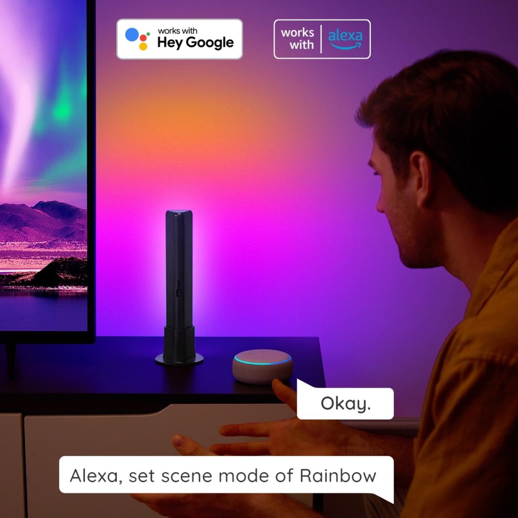 Walking Pad Lyspanel 38mm Wi‑Fi/Bluetooth stående foran lilla-rosa vegg med smart høyttaler og person i profil.