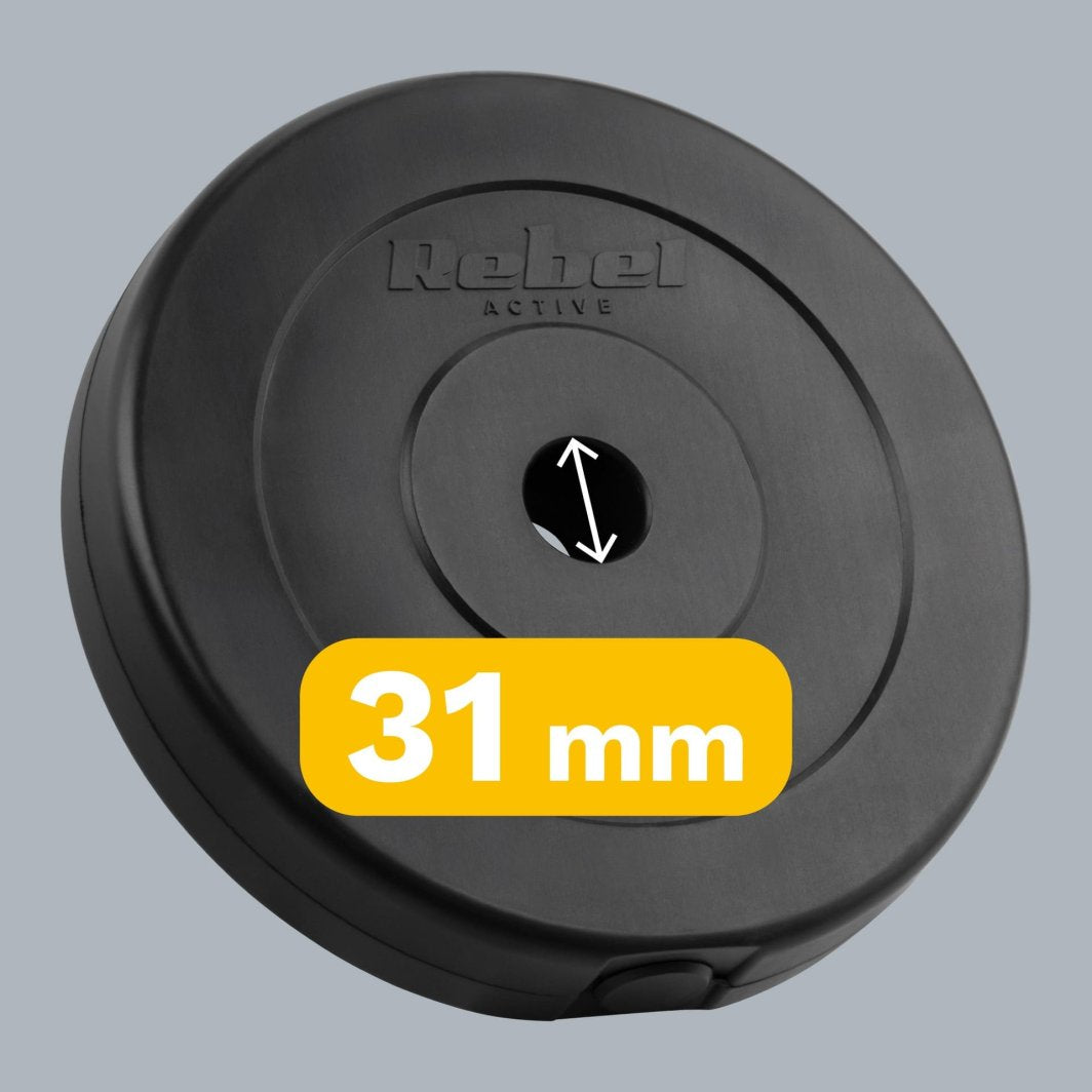 Vektplater i bitumen, fire svarte skiver à 5 kg med 31 mm hull, stablet på hverandre.