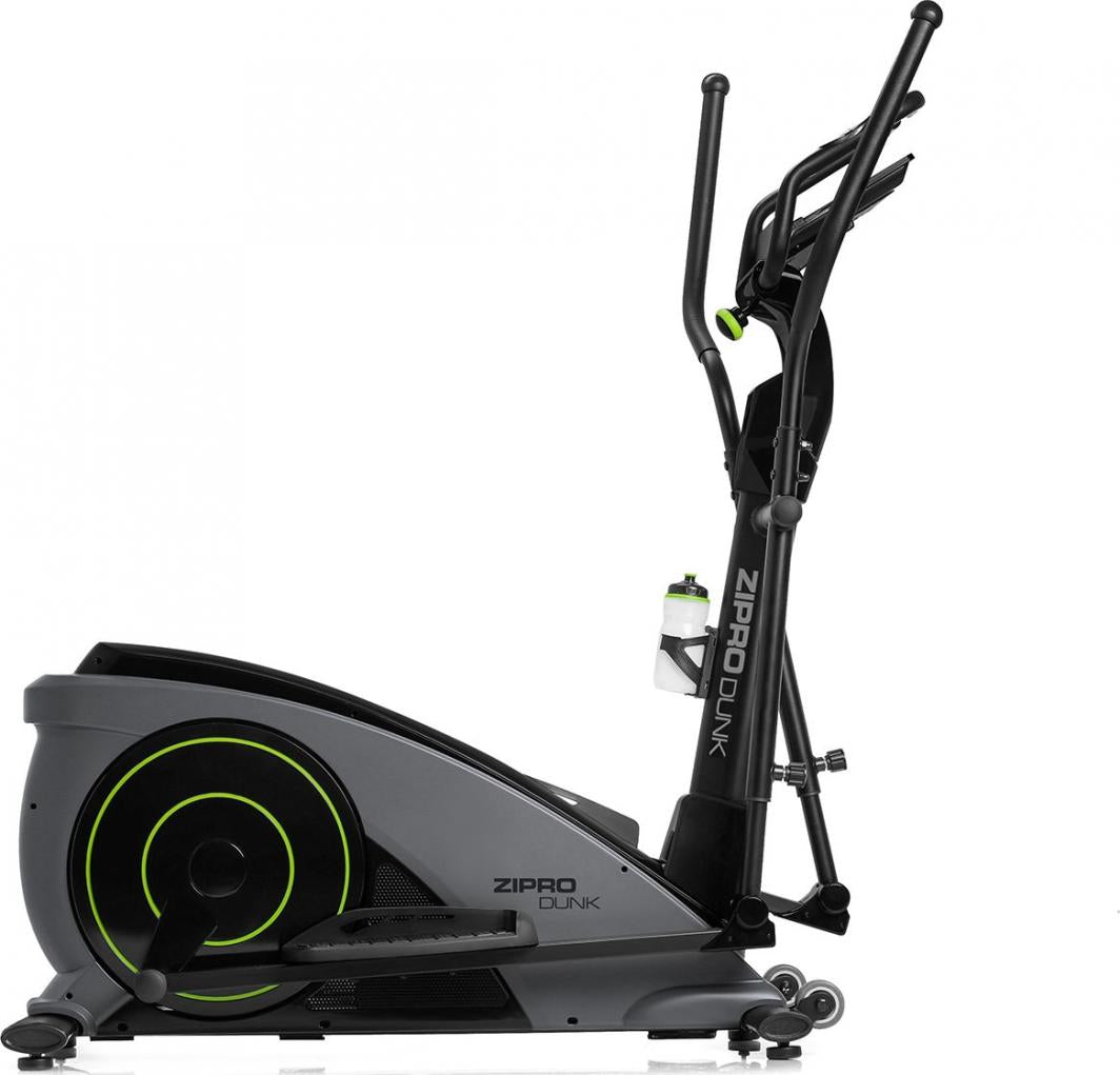 Crosstrainer i sort og grå med grønne detaljer, sett fra siden, viser pedal, håndtak og flaskeholder med vannflaske.