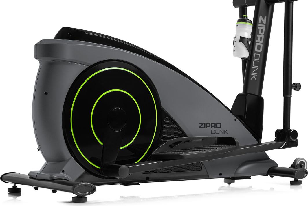 Orbitrek i mørk grå og svart med grønne detaljer, sett fra siden, store pedaler og drikkeflaske i holder.