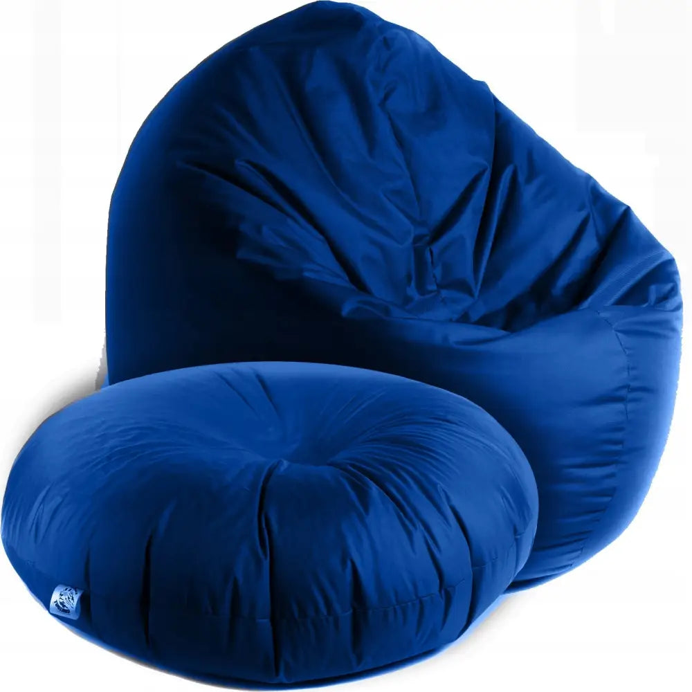 2-i-1 barnepuff og sakkosekk i blått, avrundet form med matchende lav puff og mykt tekstiltrekk.