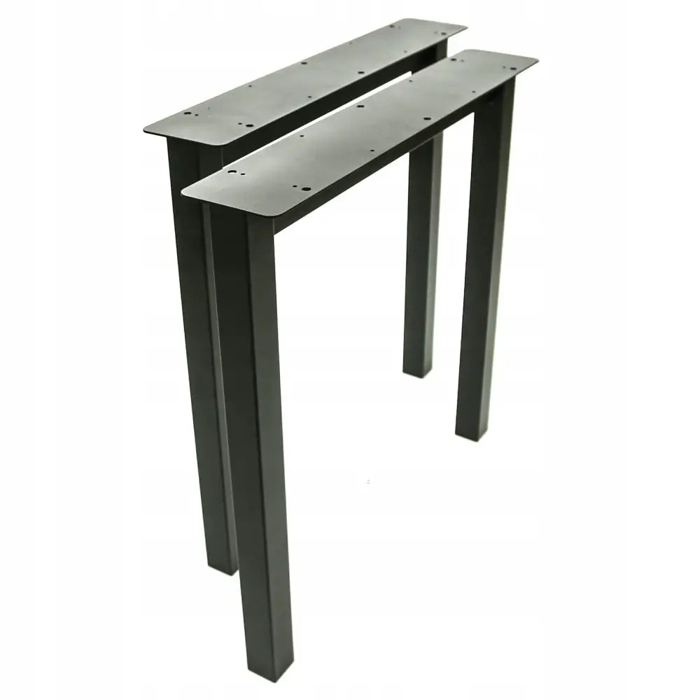 To svarte metallben til bord, rektangulær utforming, sett skrått ovenfra med synlige forborede monteringshull.