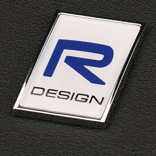 Emblem/logo til Volvo R-Design for bakluke i sølv, blå og svart, original Volvo-del