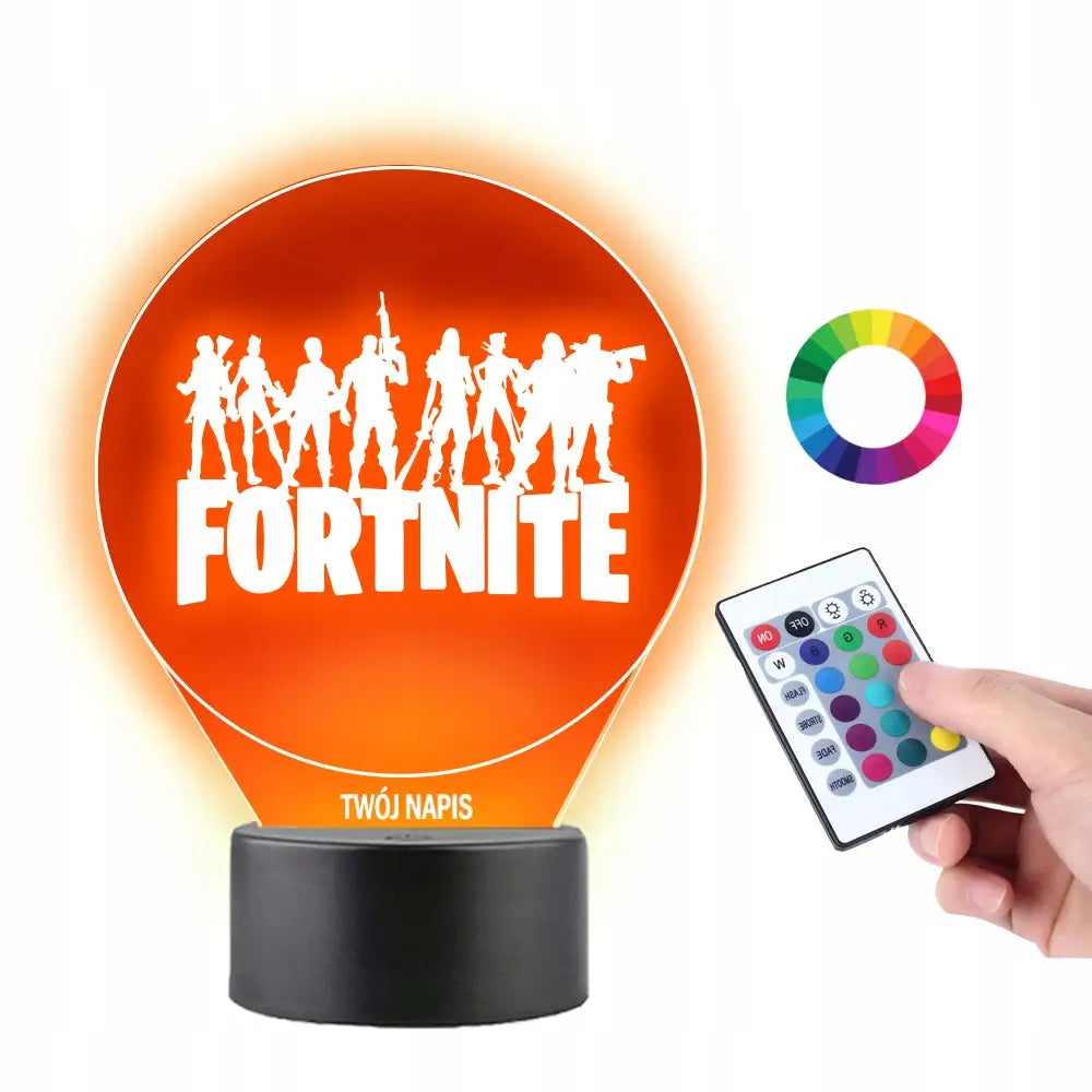 3D Fortnite-spill skrivebordslampe med oransje LED-lys, hvite silhuetter og sort sokkel, fjernkontroll foran.