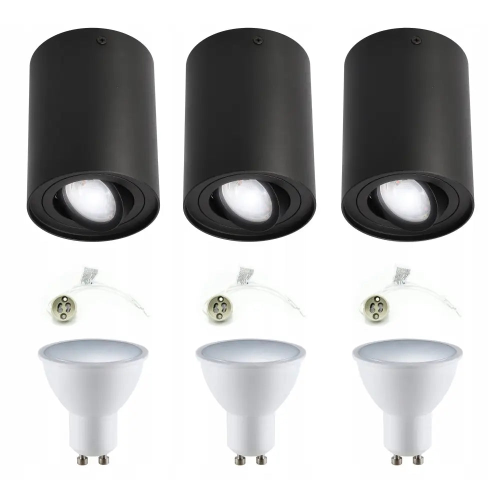 Overflatemontert halogen spotlys, tre sorte sylindere med hvite LED-pærer og sokkeladapter, frontvisning.