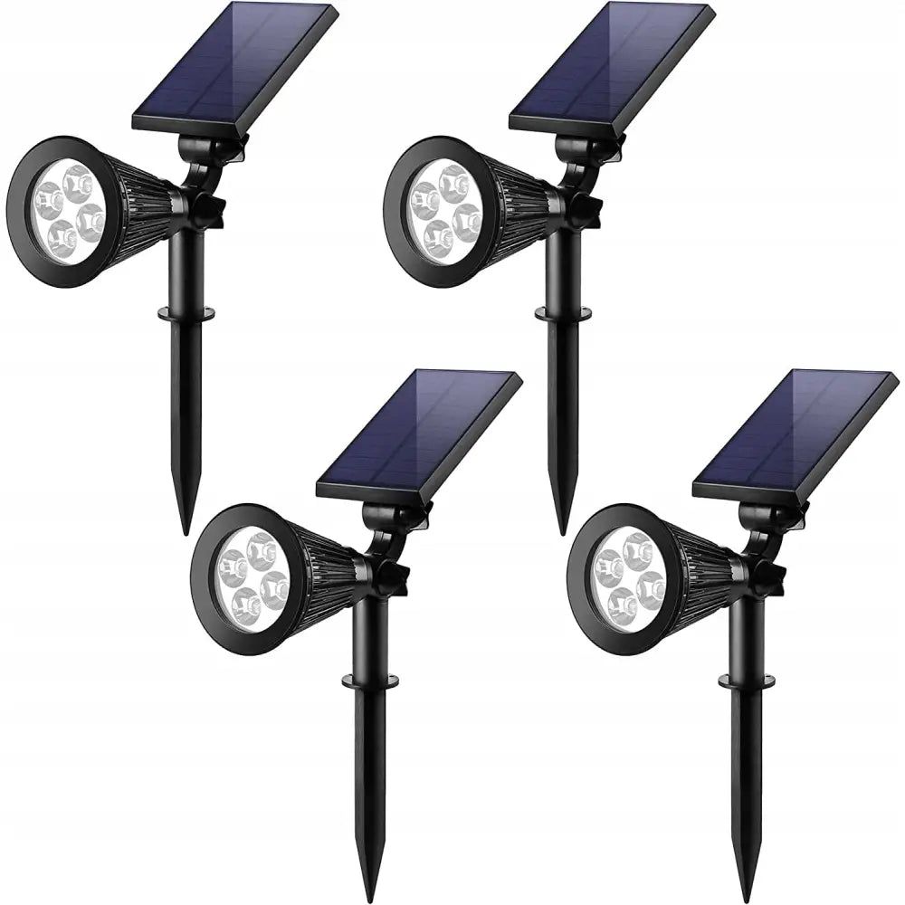 Solcellelampe LED hagespotlys, fire svarte spotlights med solcellepanel og fire LED-pærer på jordspyd.