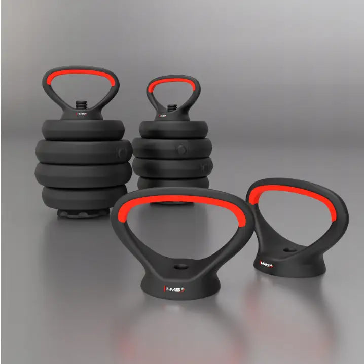 6-i-1 vektsett, nærbilde av svarte håndtak med rød detalj, to runde vekter synlige i bakgrunnen.