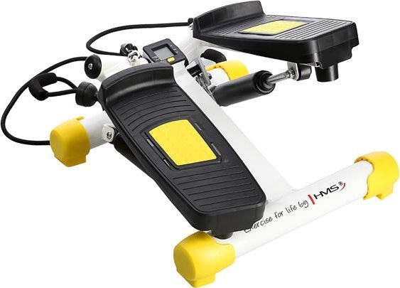 Stepmaskin med svarte fotplater, gule detaljer, hvit ramme og synlige motstandsbånd, sett fra skrå vinkel.