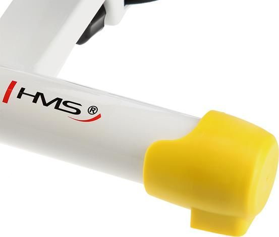 Mini Stepper med hvit metallramme, HMS-logo og gul plasthylse på enden, sett fra siden.