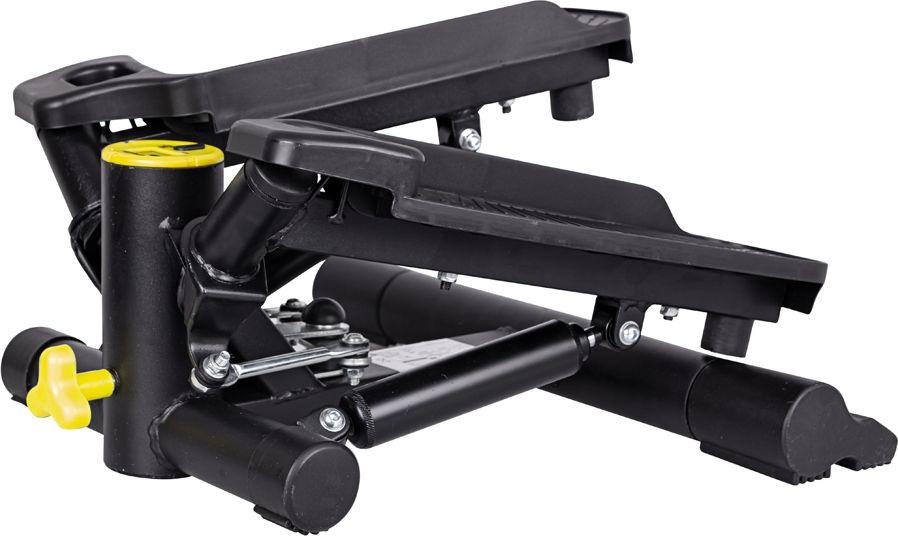 Stepper Trening sort apparat med to fotplater, gule detaljer og synlig justeringsskrue, sett fra siden.