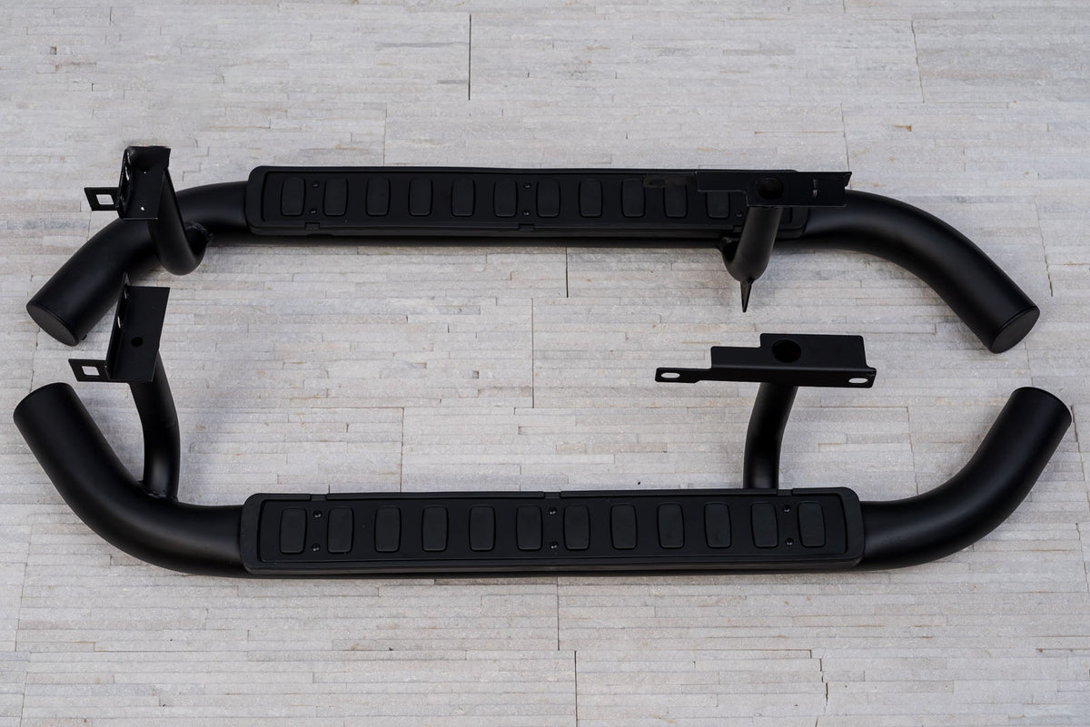 Stigtrinn Land Rover Defender Ventshield (2003-2016) - sett forfra