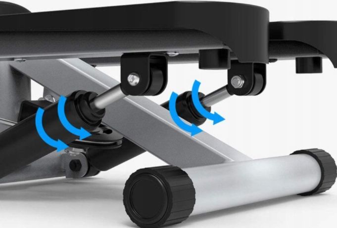 Stepper Trening justeringsmekanisme på treningsbenk med svarte og grå metalldeler, skruefester og blå rotasjonspiler.