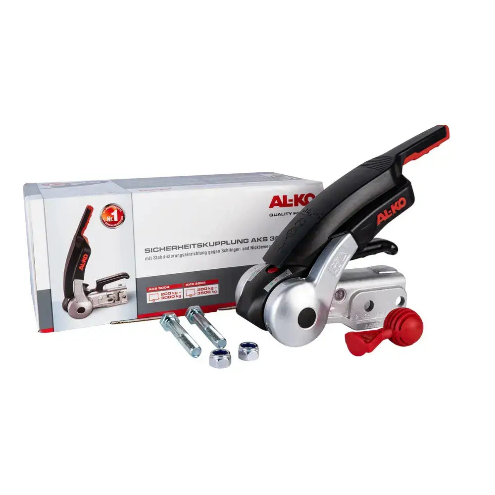 AL-KO AKS 3504 kulekobling med tyverisikring, skrå forfra med håndtak, festebolter og emballasje.