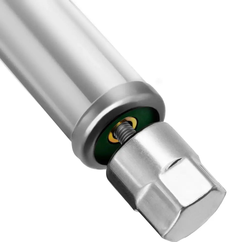 Metallisk sylinder med gjenger og sekskantet ende, viser kobling og fjær til arbeidsbenkens mekanisme.