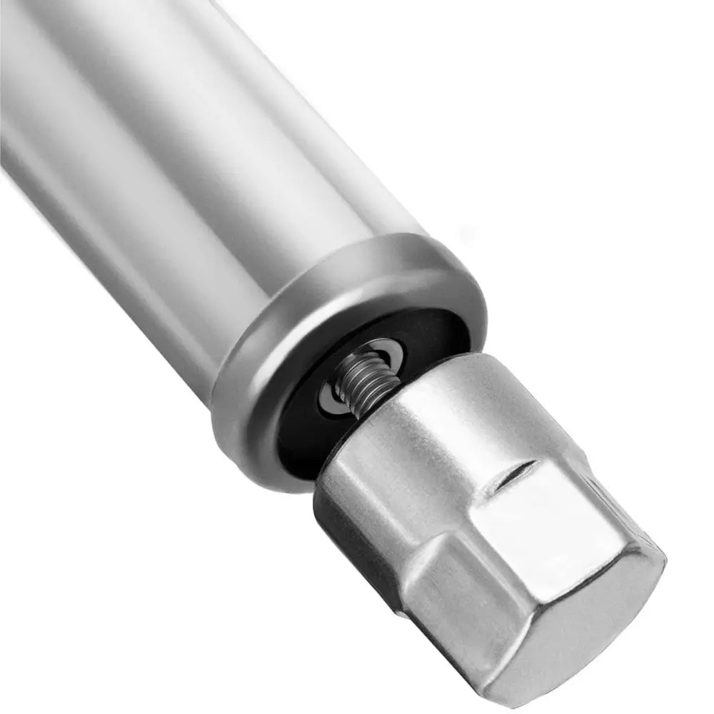 Arbeidsbenk med sentralstålblad, detaljert nærbilde av sekskantet metallende og fjærmekanisme fra skrå vinkel.