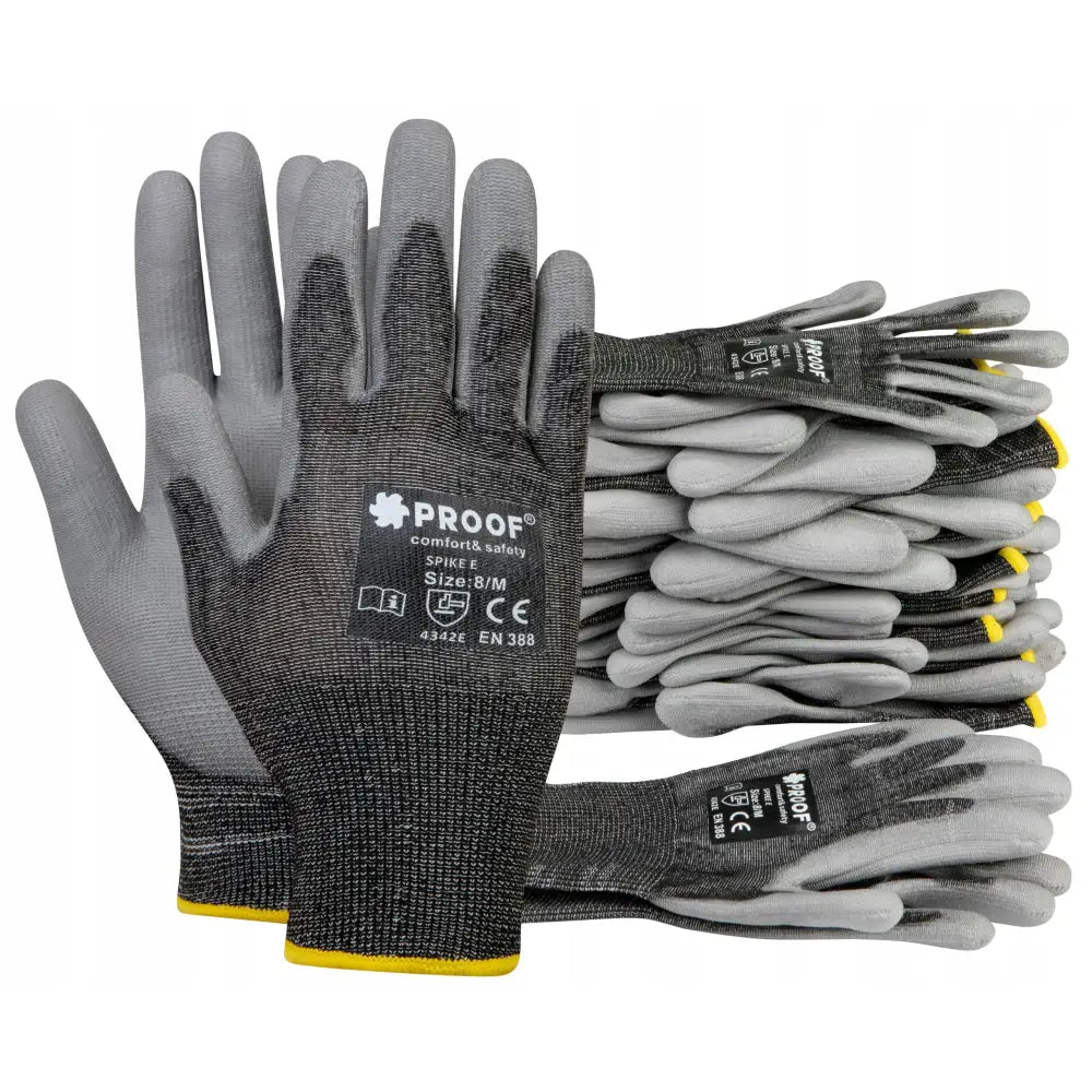 Arbeidshansker mot kutt E Spike, grå og sorte med hvit tekst og gul kant, sett fra oversiden.