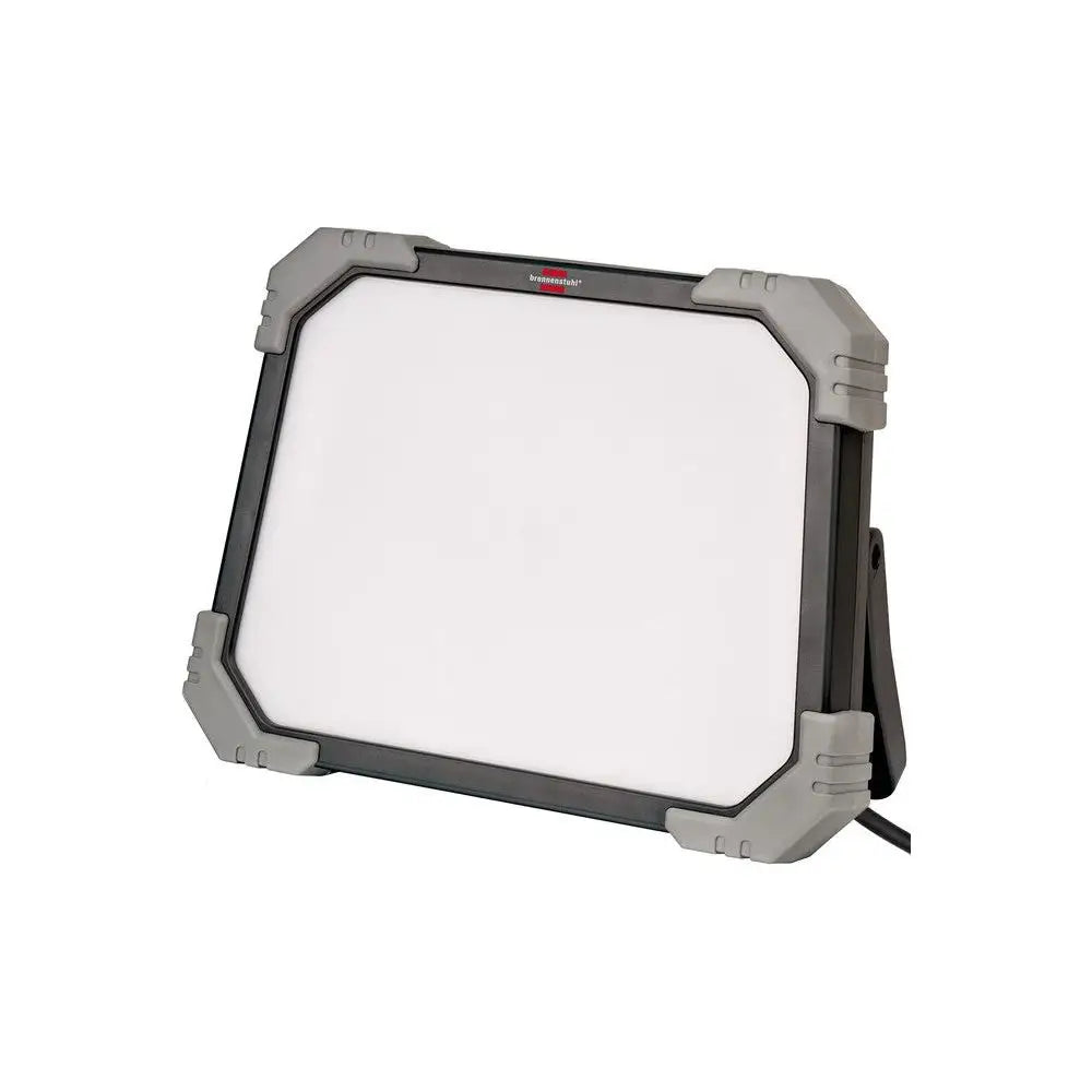 LED arbeidslys DINORA med hvit front, sorte rammer og grå hjørner sett fra skrått sideperspektiv.