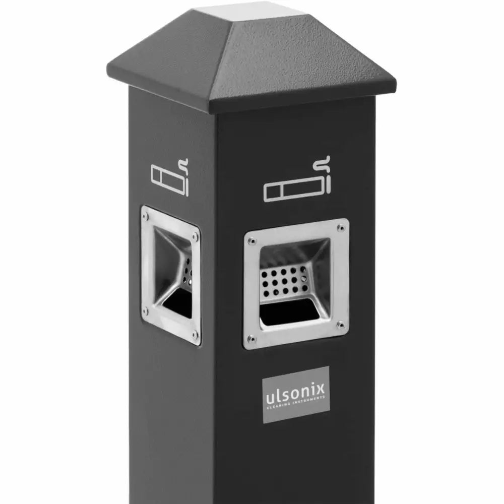 Sort askebeger i metall, skråvisning med to innkast, stålkant og sigarettsymboler på siden.
