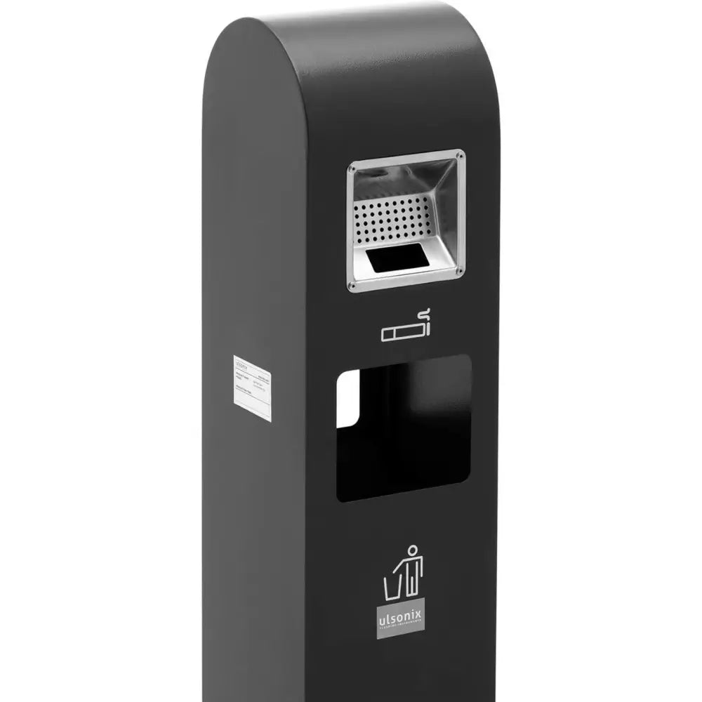 Askebeger stående med søppelkurv i mørk grå, sidevinkel som viser perforert askebeger-del og tydelige symboler.