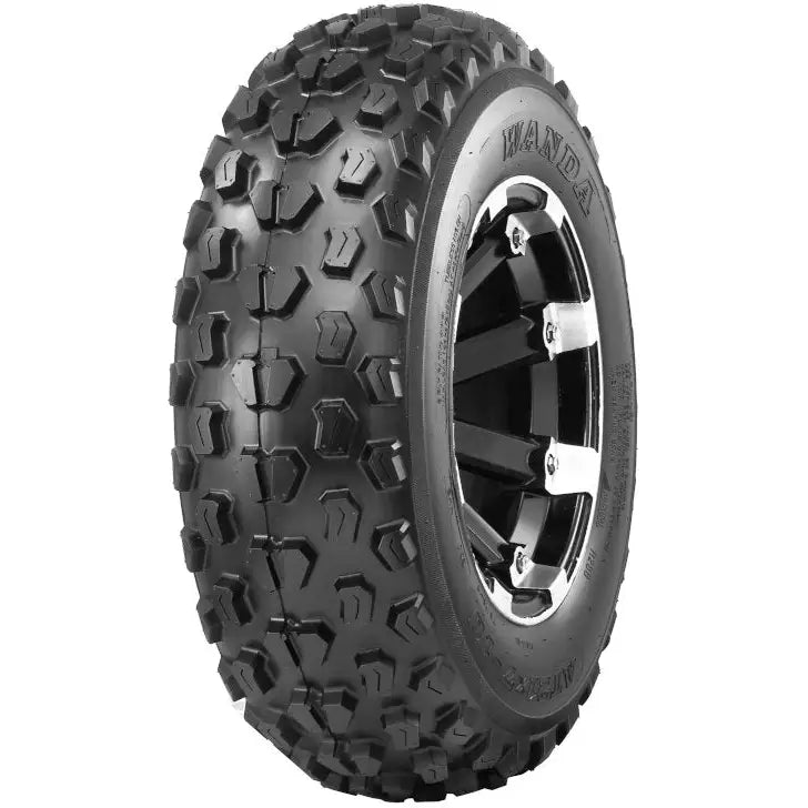 Atv Dekk 22x7-10 Journey, skråvisning som fremhever grove knaster og felgdetaljer i slitebanen.