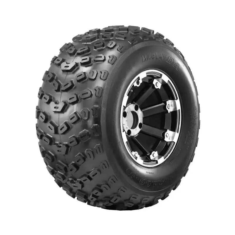 Atv Dekk 22x11-10 Journey, skrå sidevisning med markante knaster og svart felg med sølvdetaljer.