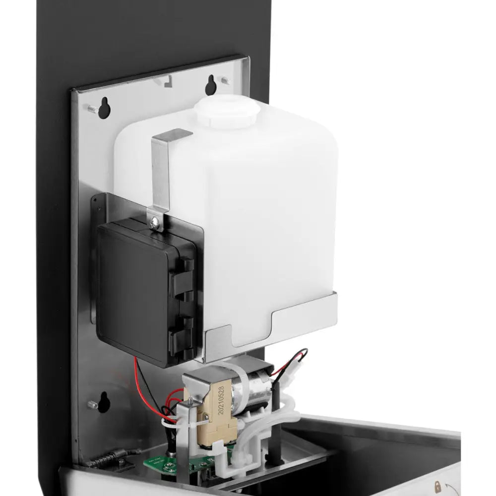 Automatisk berøringsfri desinfeksjonsstasjon, sidevisning av innsiden med fokus på beholder og elektronikk.