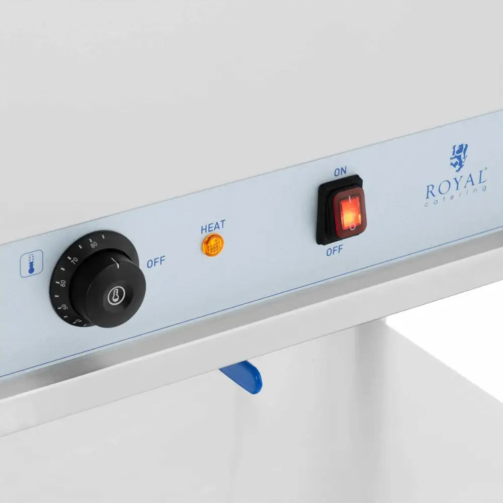 Betjeningspanel på elektrisk matvarmebrett, viser termostat, varsellys og av/på-bryter med Royal Catering-logo.