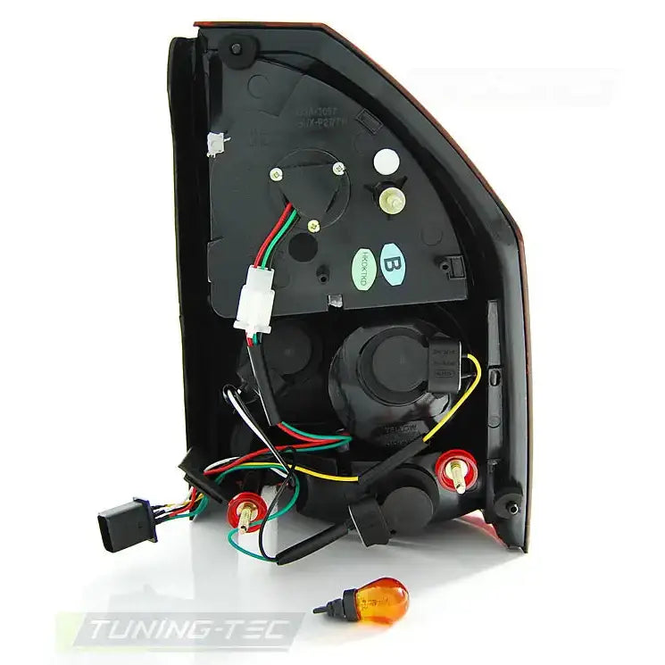 Baklamper Chrysler 300C 09-10 LED svart bakdeksel med ledninger, kontakter og oransje pære foran.