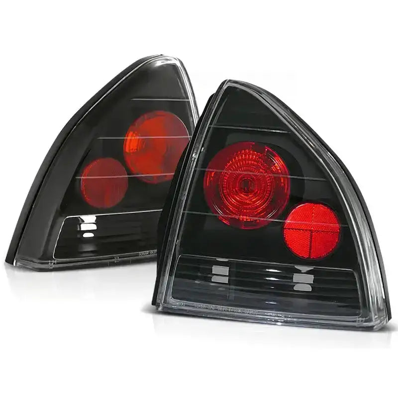 Baklykter Honda Prelude 02.92-01.97 Black med røde sirkulære lys og sort bakgrunn, sett skrått forfra.