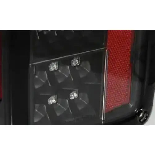 Baklykt Jeep Wrangler JK LED sort med fire synlige LED-pærer og rødt reflektorfelt.