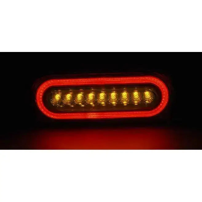 Baklamper Mercedes W463 G-KLASA LED sett forfra med rød ramme og ni gule lysdioder i midten.