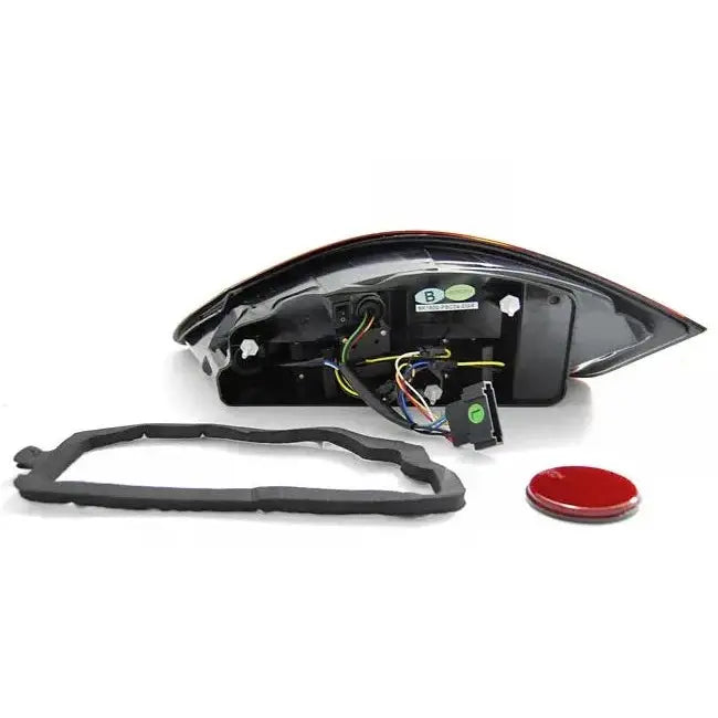 Baklykter Porsche Boxster 987 svart LED, bakside med ledninger, kontakter, pakning og rød reflektor.