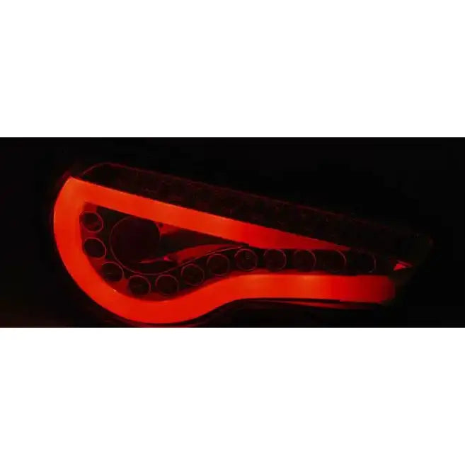 Baklys Toyota GT86 LED Bar Black med buet design og rød LED-belysning synlig i mørket.