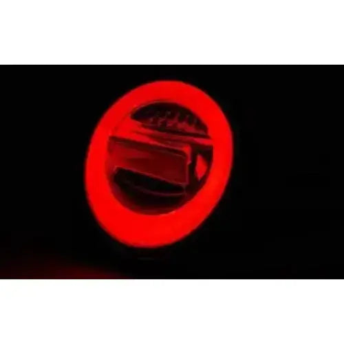 Baklykt Vw Beetle 10.98-05 med rød LED-ring og sentral knapp, avbildet i mørkt miljø.