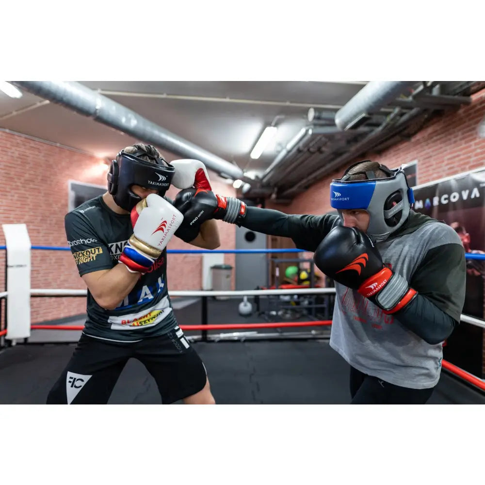 Boksehansker Naturlig Skinn PRO SPIDER 14 oz brukes under treningskamp mellom to boksere i boksering.