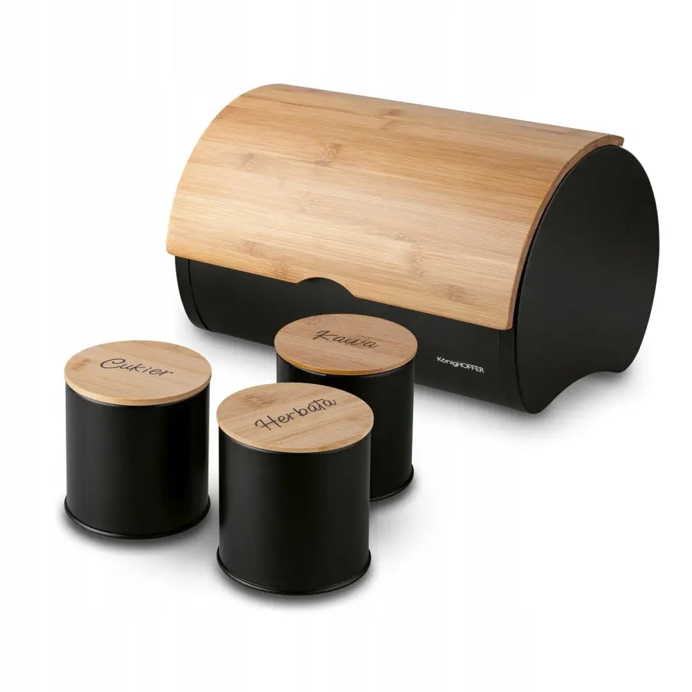 Brødboks sett med tre små beholdere i matt svart metall, lyse trelokk, sett fra skrå vinkel.