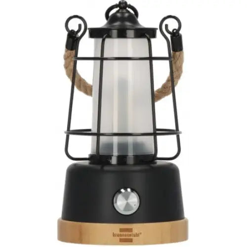 Campinglampe i retrostil, frontvisning med matt glass, bronsefarget gitter og tykt tauhåndtak på hver side.