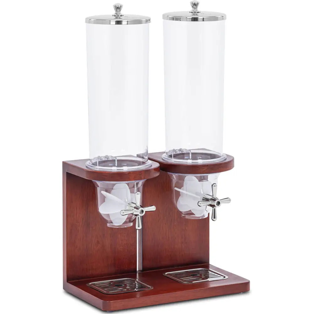 Dobbelt dispenser for nøtter og snacks, skråvisning av to beholdere med kromkraner på mørk trebase med dryppbrett.