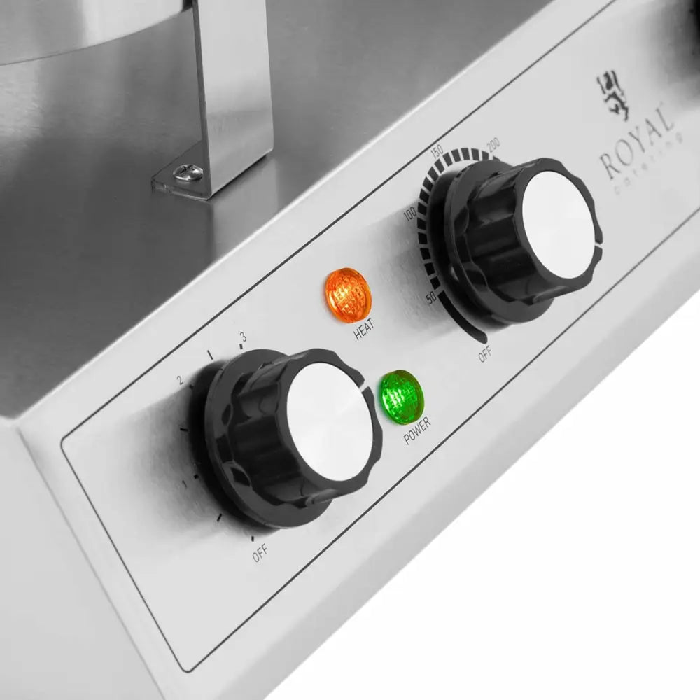 Dobbelt hjerteformet vaffeljern, nærbilde av dreiebrytere, indikatorlamper og markeringer på frontpanelet.