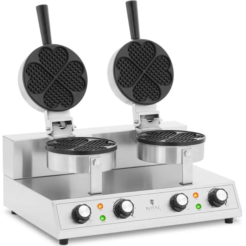 Dobbelt hjerteformet vaffeljern med åpne lokk, synlige svarte håndtak og frontmontert kontrollpanel.