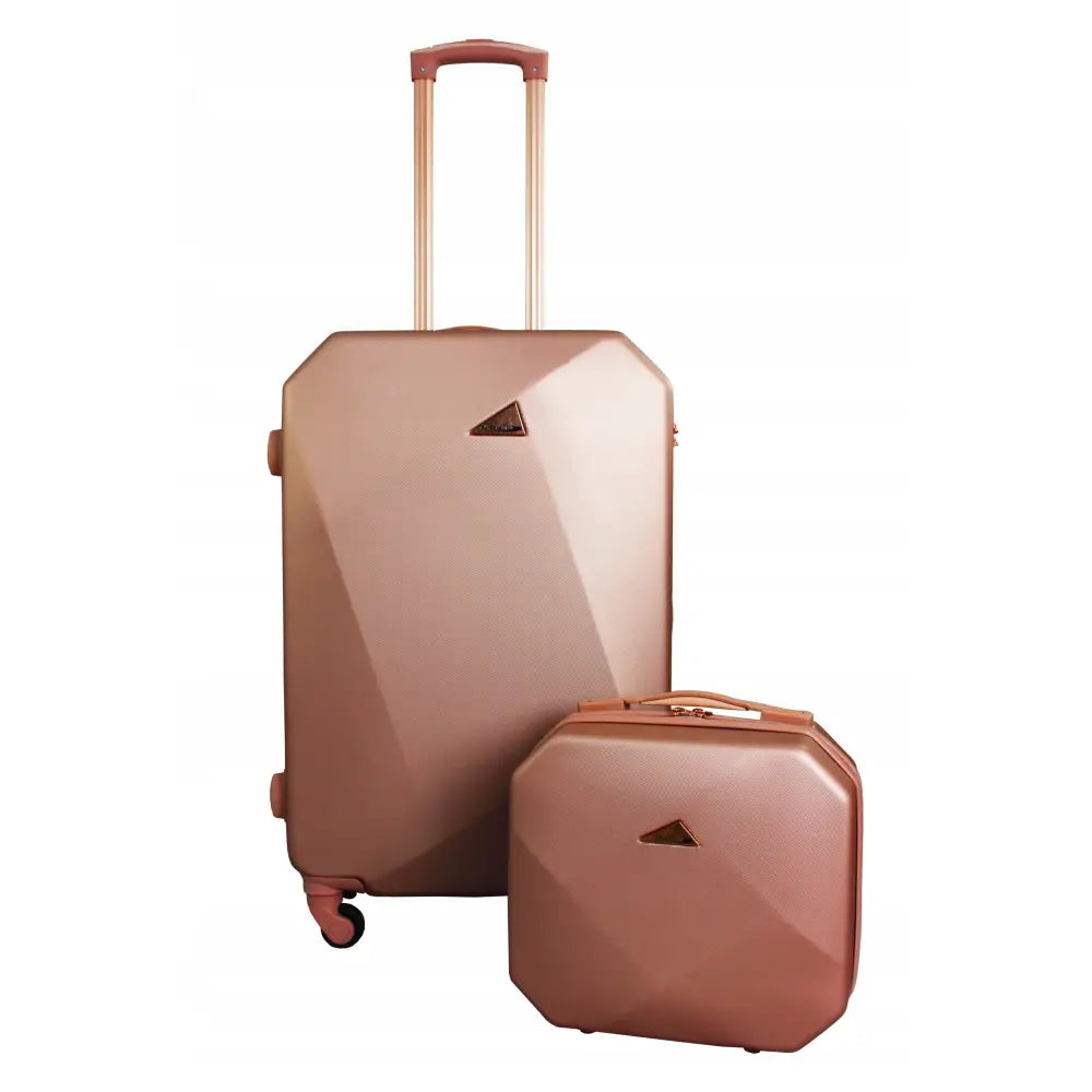 Elegant XL reisekoffert i roségull, hardt ABS-skall, teleskophåndtak og fire hjul, geometrisk overflate.
